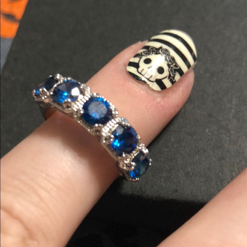 Lab created blue sapphire and white topaz ring